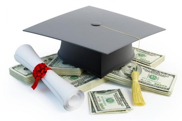 Money and diploma on a white surface