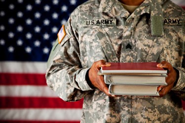 military man carrying books